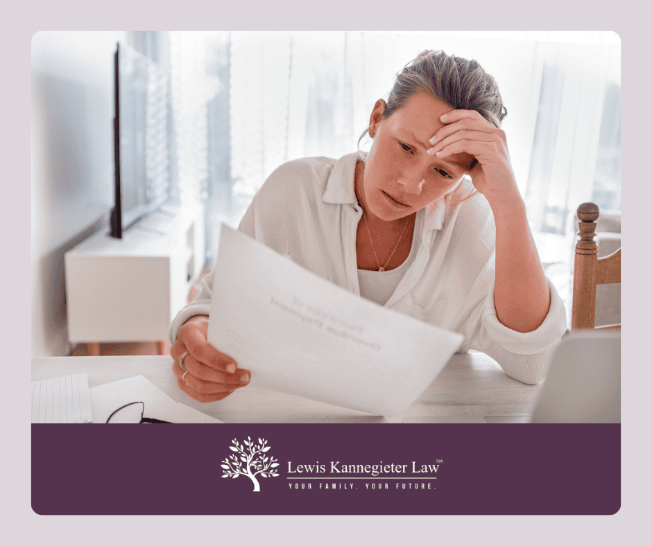 Debt Stressed woman looking at paper